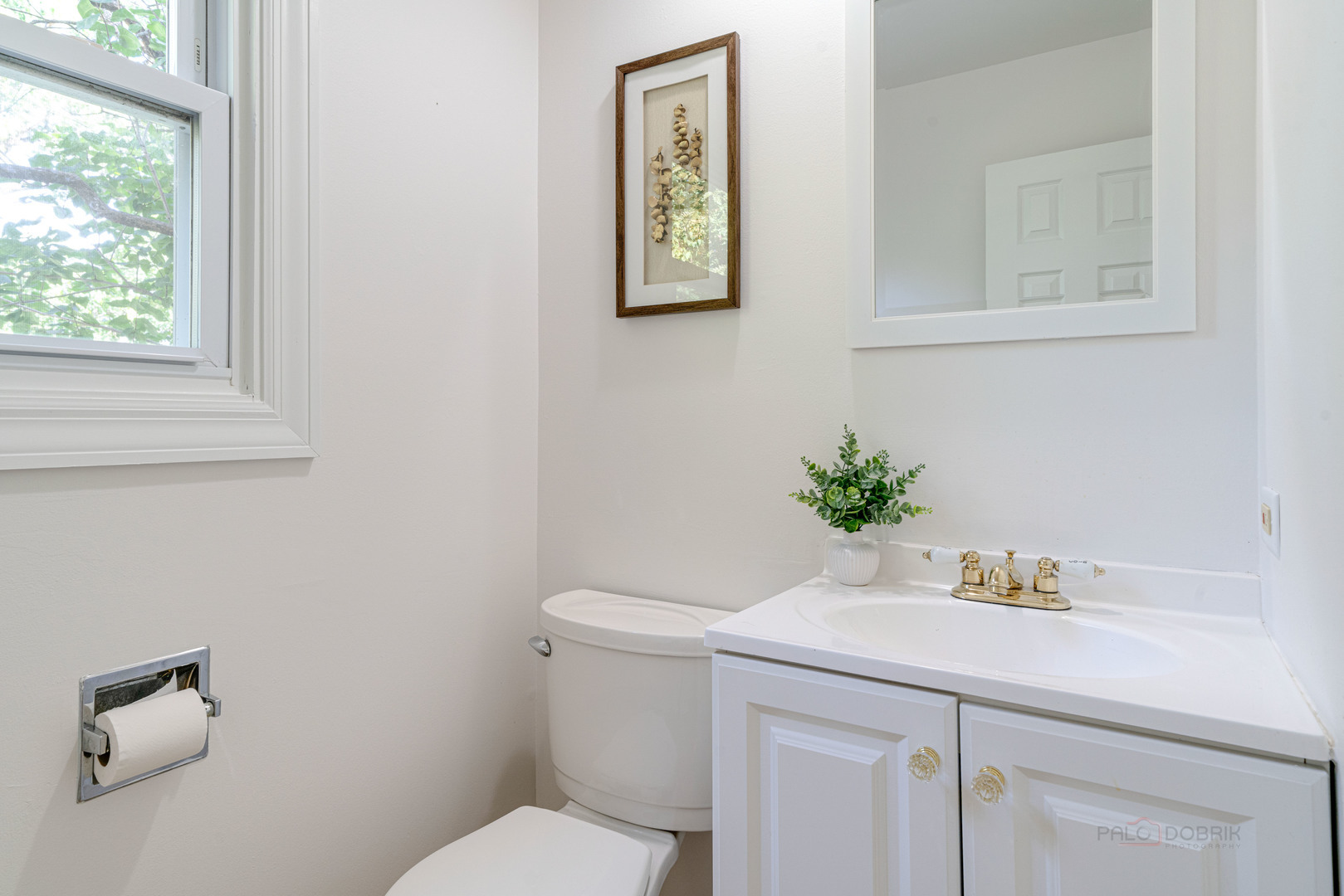 887 Saybrook Lane Buffalo Grove, IL 60089 - Photo 15 of 28 a bathroom with a sink a toilet and a mirror