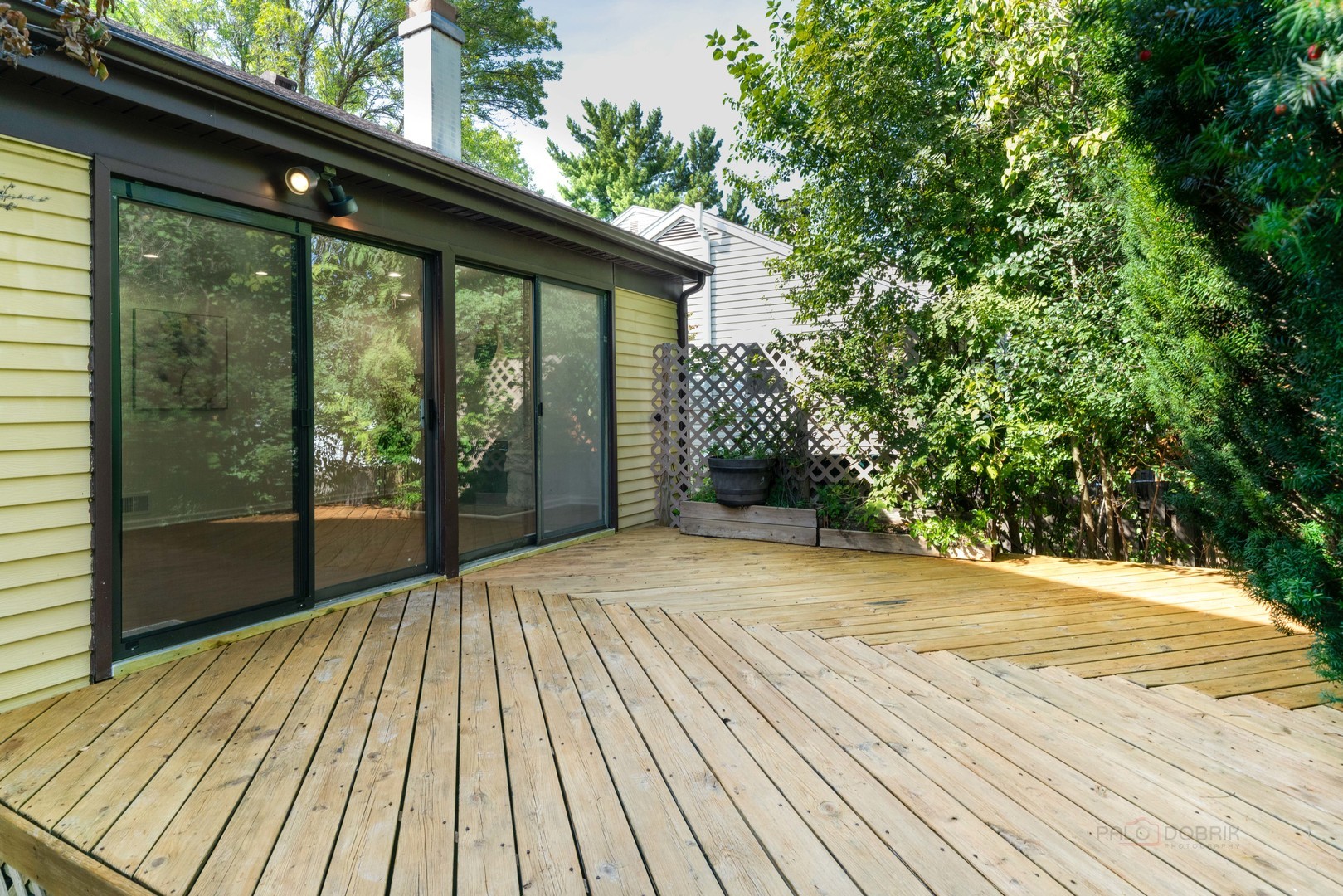 887 Saybrook Lane Buffalo Grove, IL 60089 - Photo 26 of 28 a view of backyard with a deck and wooden floor
