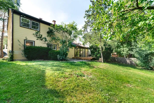a backyard of a house with lots of green space