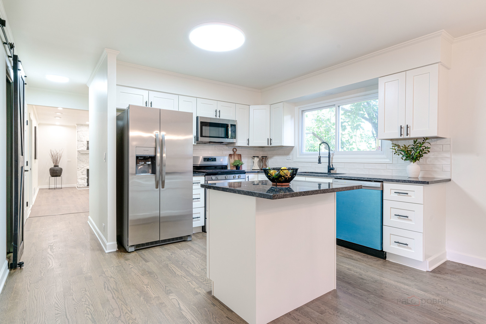 887 Saybrook Lane Buffalo Grove, IL 60089 - Photo 9 of 28 a kitchen with stainless steel appliances a refrigerator sink and microwave