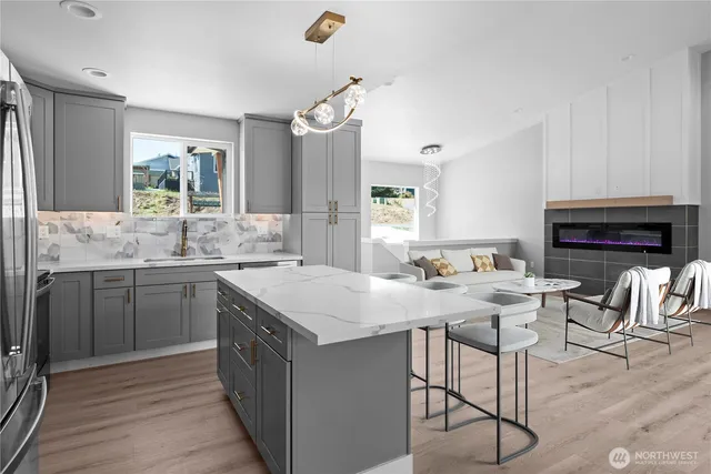a kitchen with a sink stove and cabinets