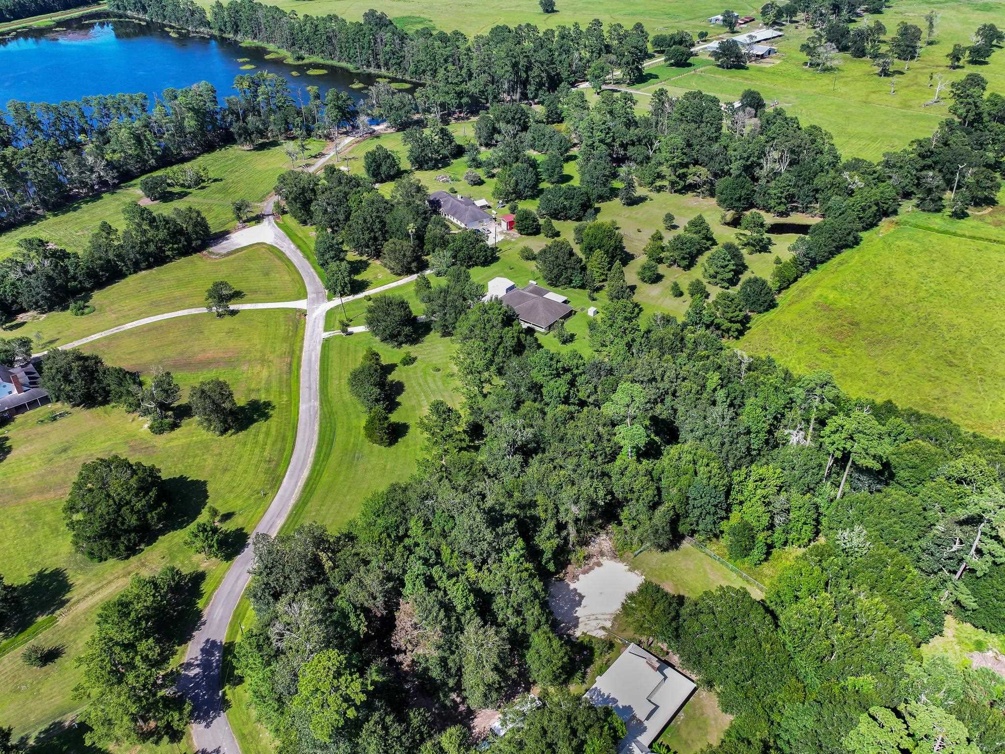 738 Parish Road Orange, TX 77632 - Photo 9 of 45 an aerial view of a house with a garden