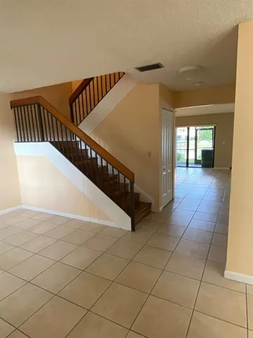 a kitchen with stainless steel appliances a stove microwave and cabinets