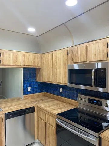 a kitchen with a stove and a sink