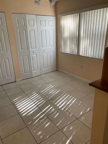 a kitchen with stainless steel appliances a sink a stove a microwave a refrigerator and cabinets