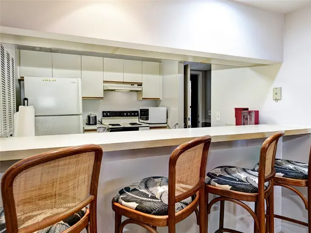 a kitchen with a sink cabinets and outdoor space