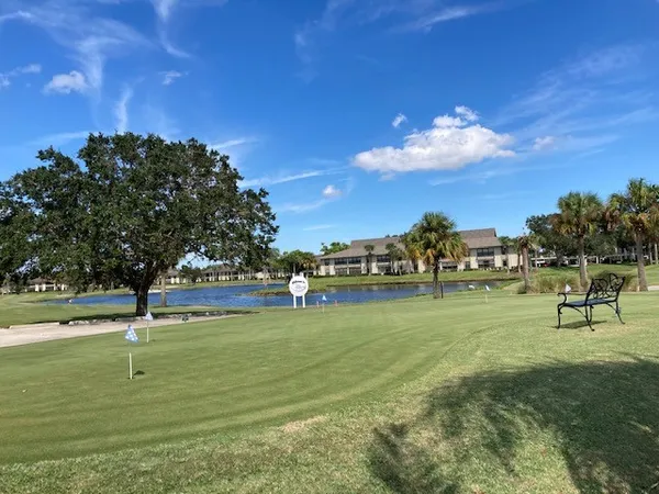 a view of a golf course with a lake view