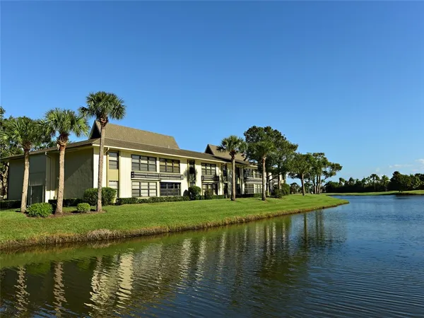 a front view of a house with a lake view