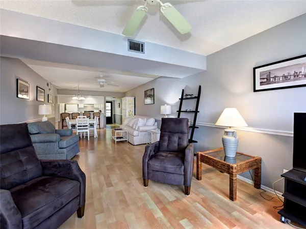 a living room with furniture and a lamp