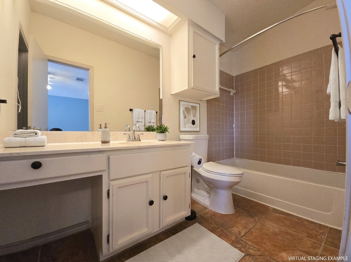 12806 Modena Trail Austin, TX 78729 - Photo 6 of 12 a bathroom with a sink a toilet and shower