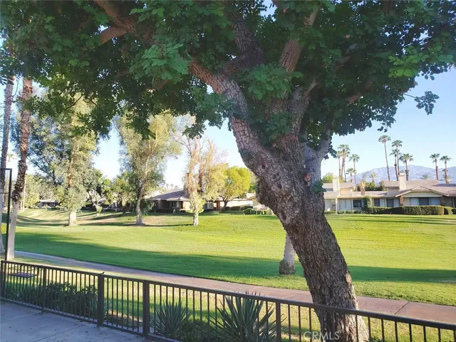 a view of swimming pool with outdoor seating and yard