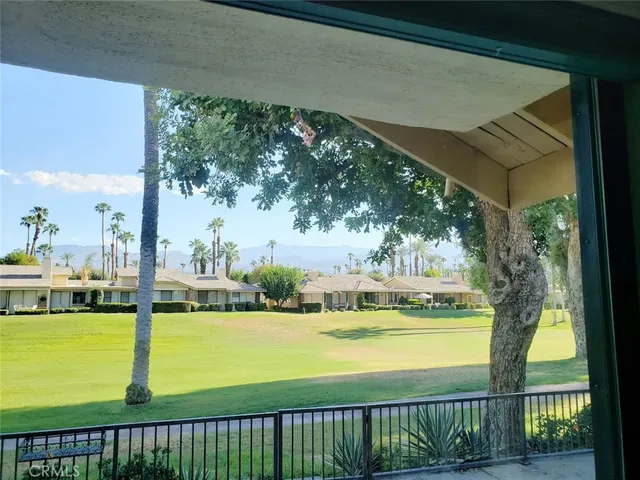 a view of swimming pool from a balcony