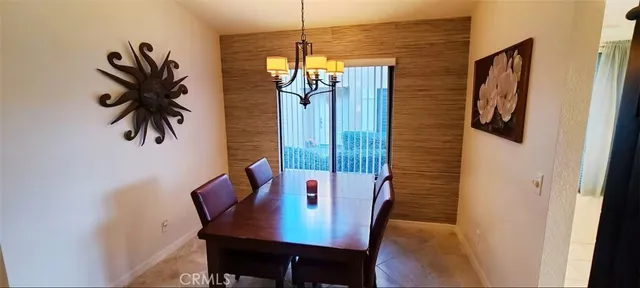 a view of a dining room with furniture and window
