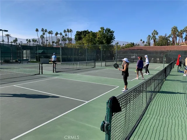 a view of swimming pool with outdoor seating and yard
