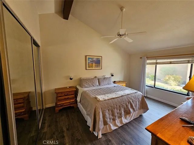 a view of a patio with table and chairs potted plants