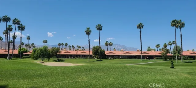 a view of a swimming pool with an outdoor space and seating area