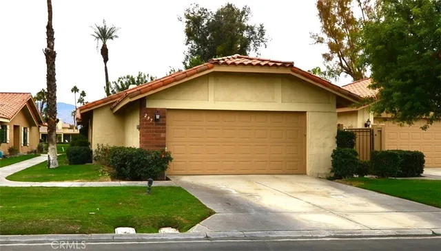 an outdoor space with swimming pool and furniture