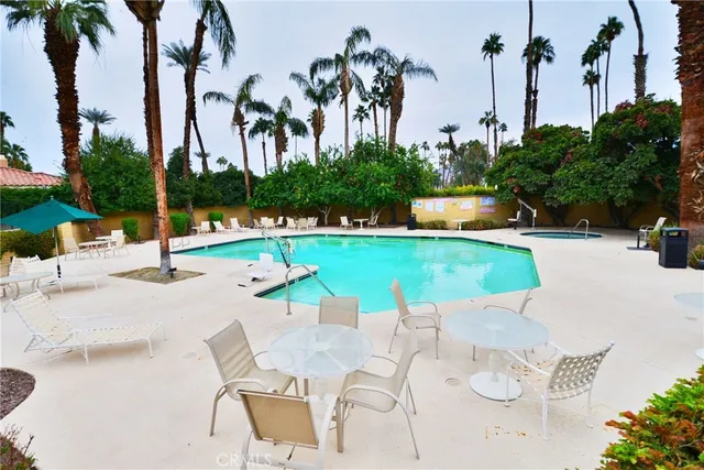 a street sign on a wall next to a road