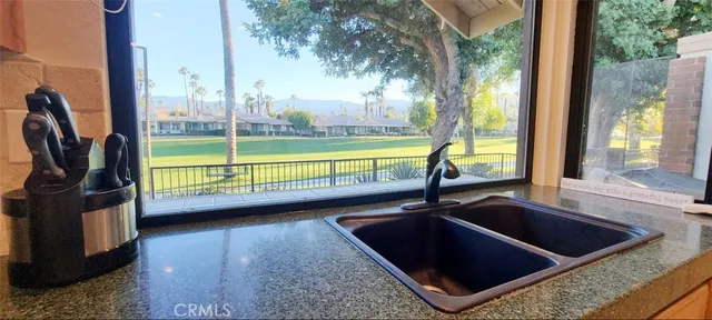 a view of a living room and floor to ceiling window
