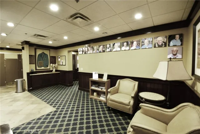 a swimming pool with outdoor seating and plants