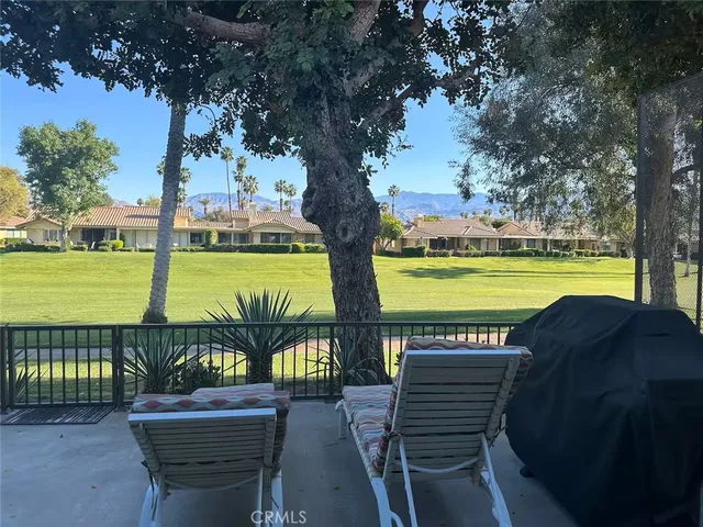 a view of a swimming pool with a table and chairs