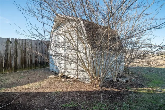a backyard of a house with lots of green space