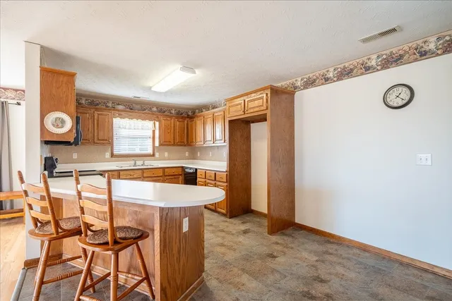a view of a dining table & chairs in a room