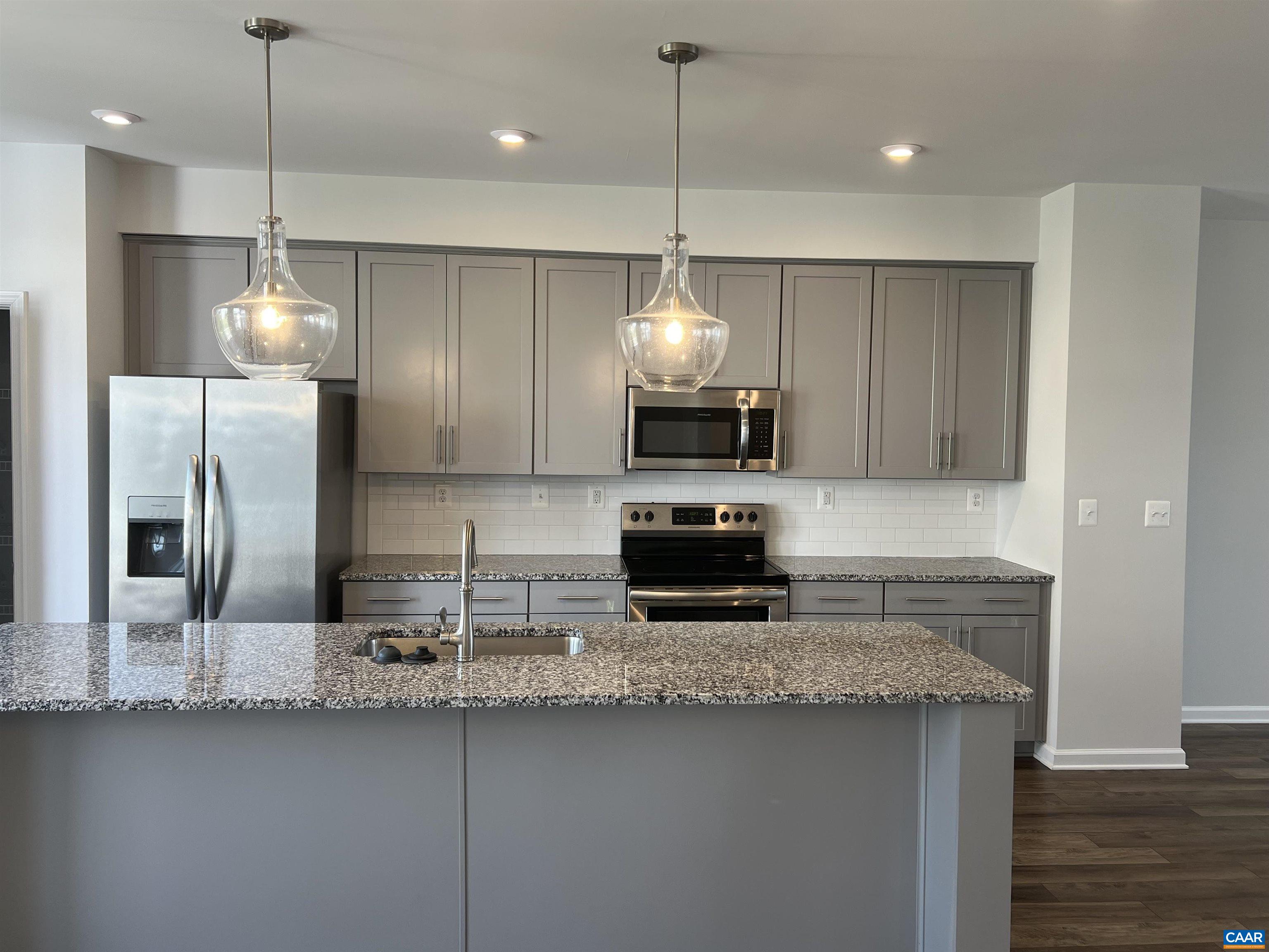 4440 Alston Street Crozet, VA 22932 - Photo 2 of 25 a kitchen with stainless steel appliances granite countertop a sink a refrigerator a stove a center island a oven with wooden floor