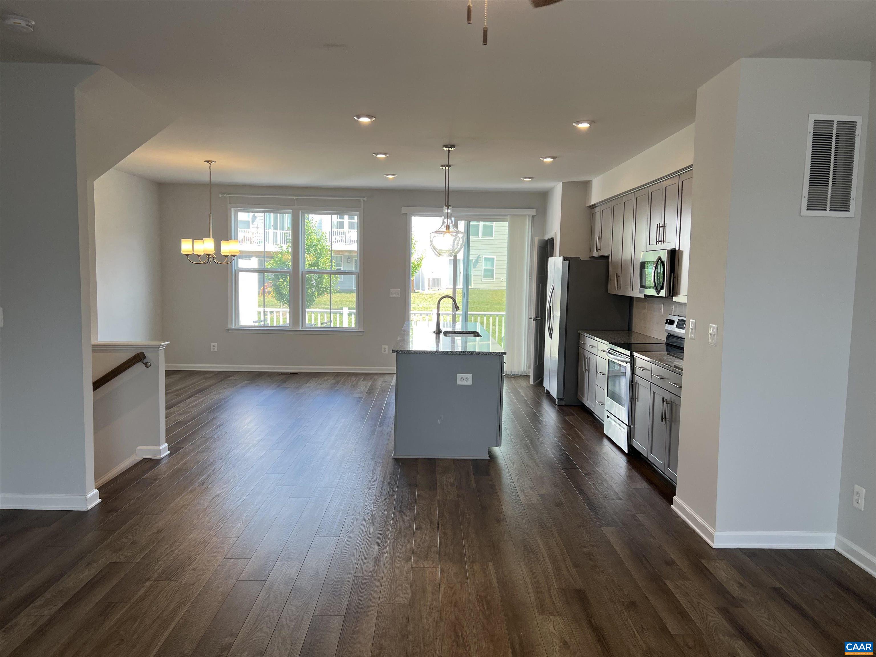 4440 Alston Street Crozet, VA 22932 - Photo 3 of 25 a view of a kitchen with furniture and wooden floor