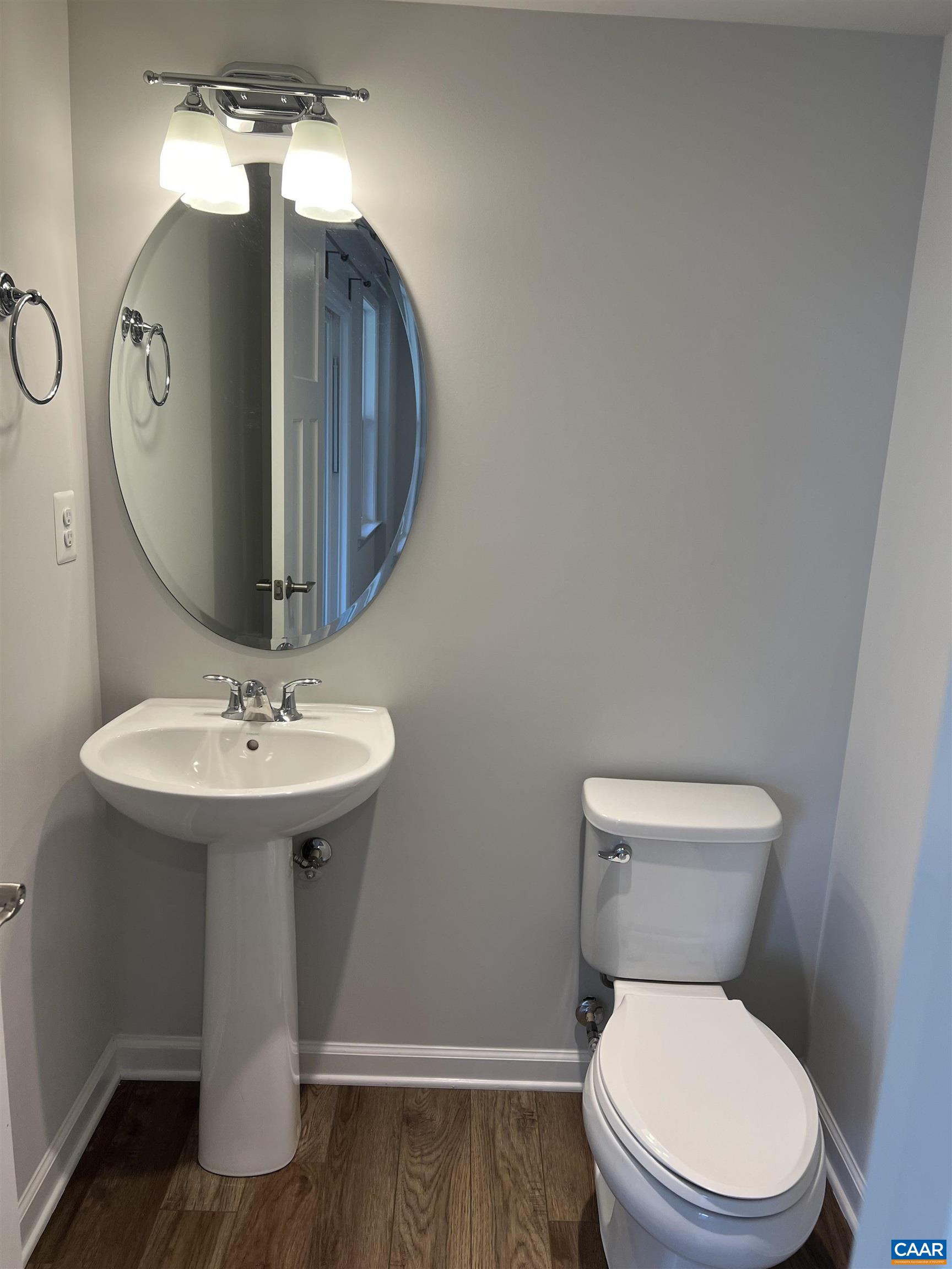 4440 Alston Street Crozet, VA 22932 - Photo 5 of 25 a bathroom with a toilet a sink and mirror