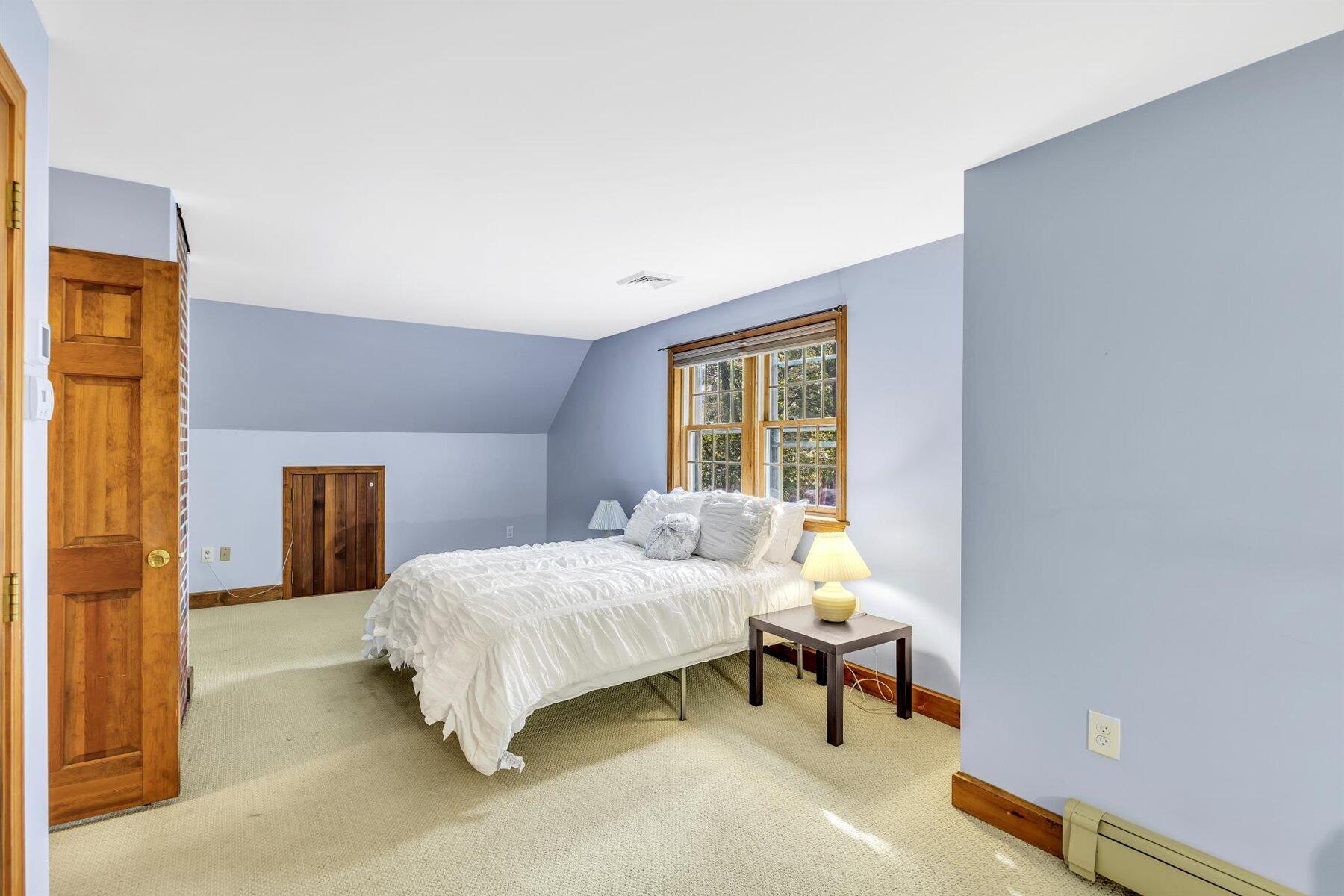 159 Old Chatham Road Brewster, MA 02631 - Photo 14 of 32 a bedroom with a bed and a window