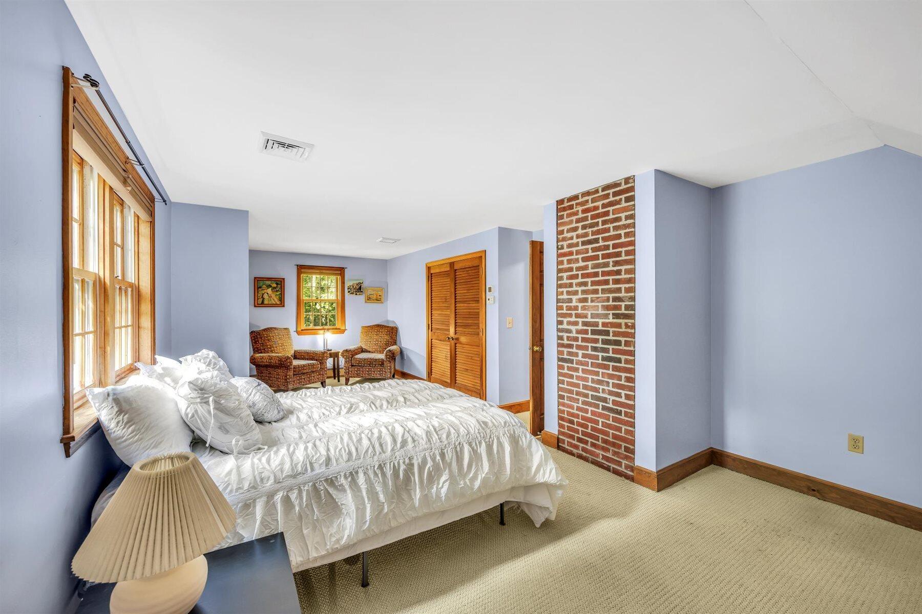 159 Old Chatham Road Brewster, MA 02631 - Photo 16 of 32 a bedroom with a bed and a window