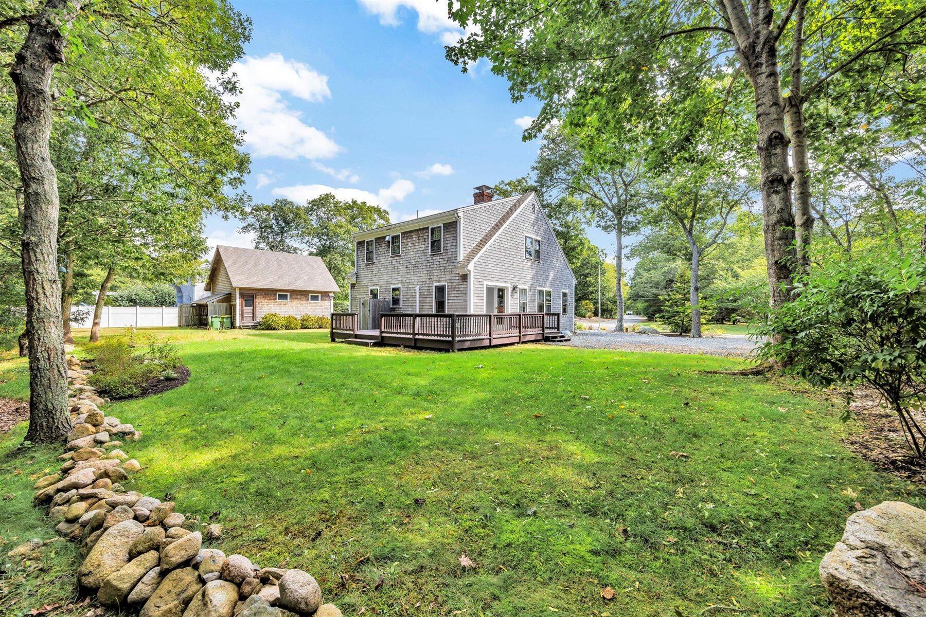 159 Old Chatham Road Brewster, MA 02631 - Photo 20 of 32 a view of a house with backyard and garden