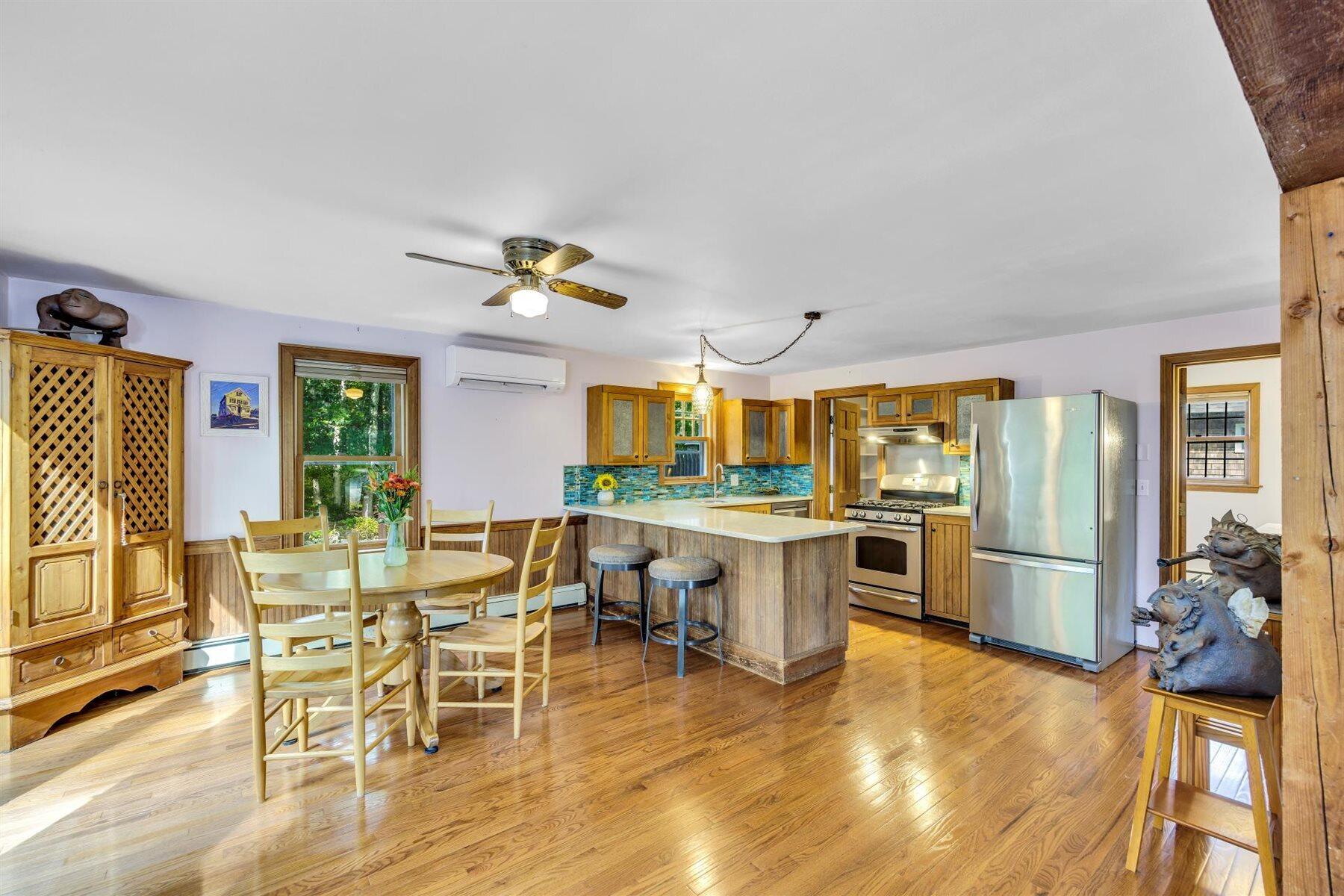 159 Old Chatham Road Brewster, MA 02631 - Photo 2 of 32 a view of a dining room with furniture window and wooden floor