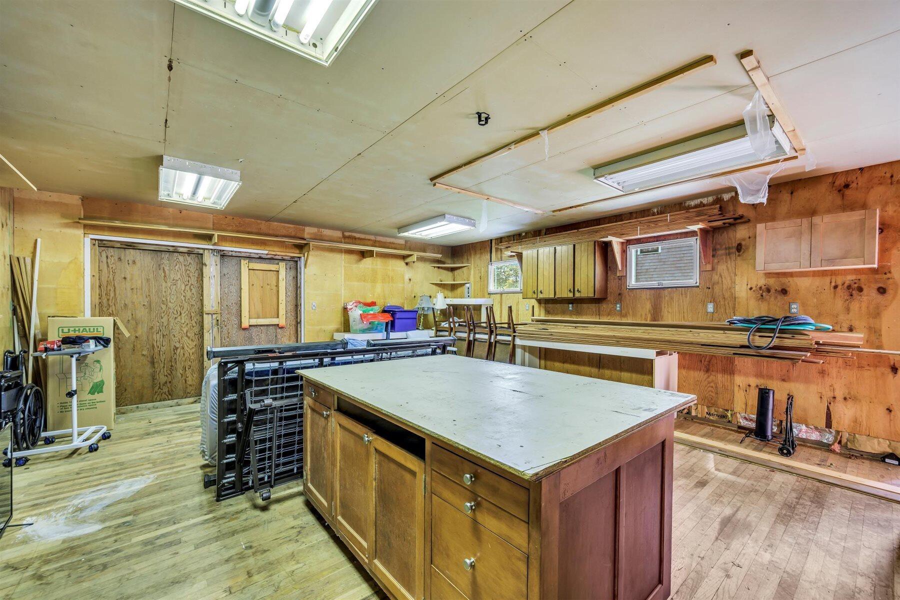 159 Old Chatham Road Brewster, MA 02631 - Photo 23 of 32 a kitchen with a stove a counter space and wooden floor