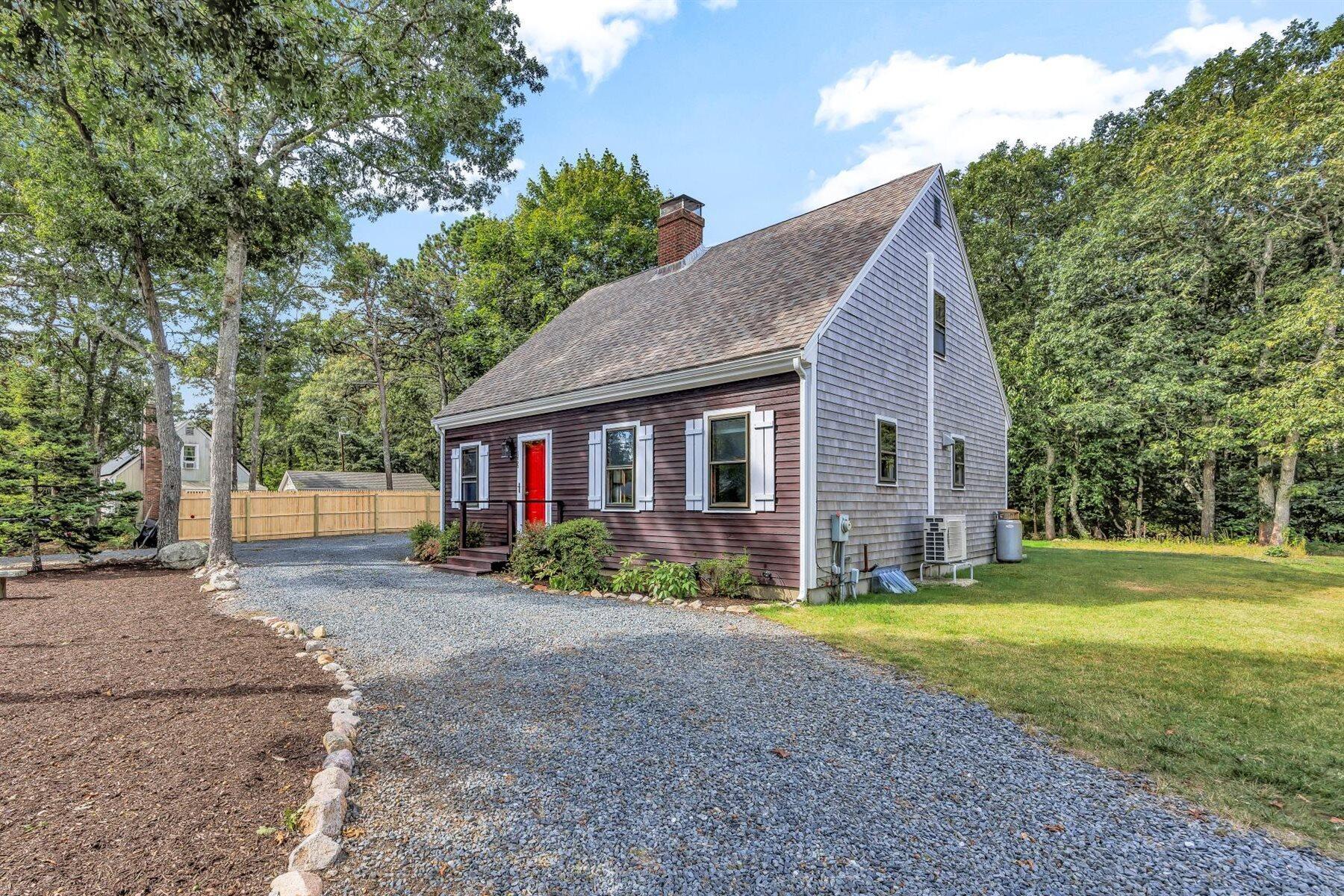 159 Old Chatham Road Brewster, MA 02631 - Photo 27 of 32 a view of a house with a yard