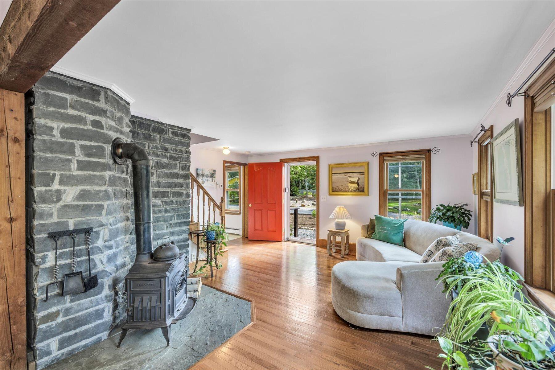 159 Old Chatham Road Brewster, MA 02631 - Photo 3 of 32 a living room with furniture and large windows