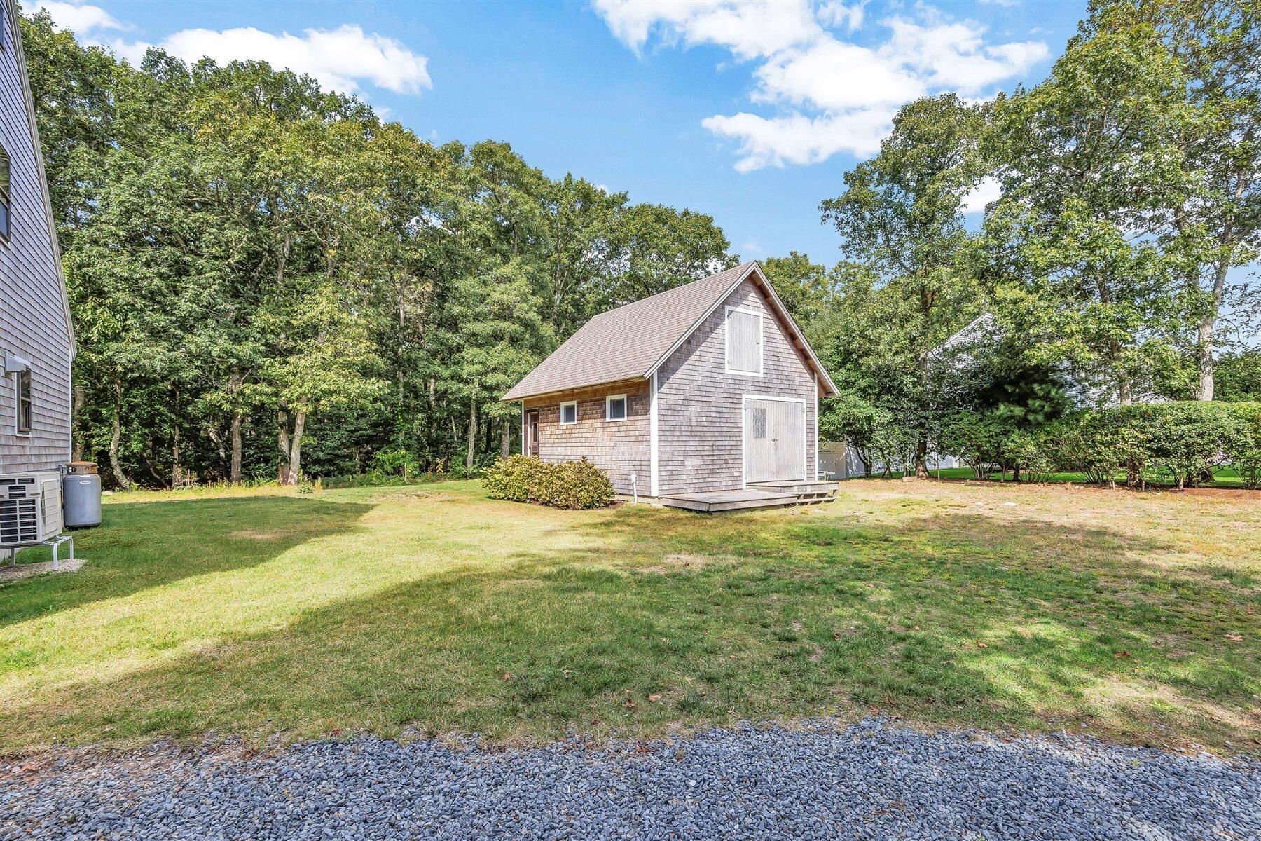 159 Old Chatham Road Brewster, MA 02631 - Photo 5 of 32 a view of a house with a yard
