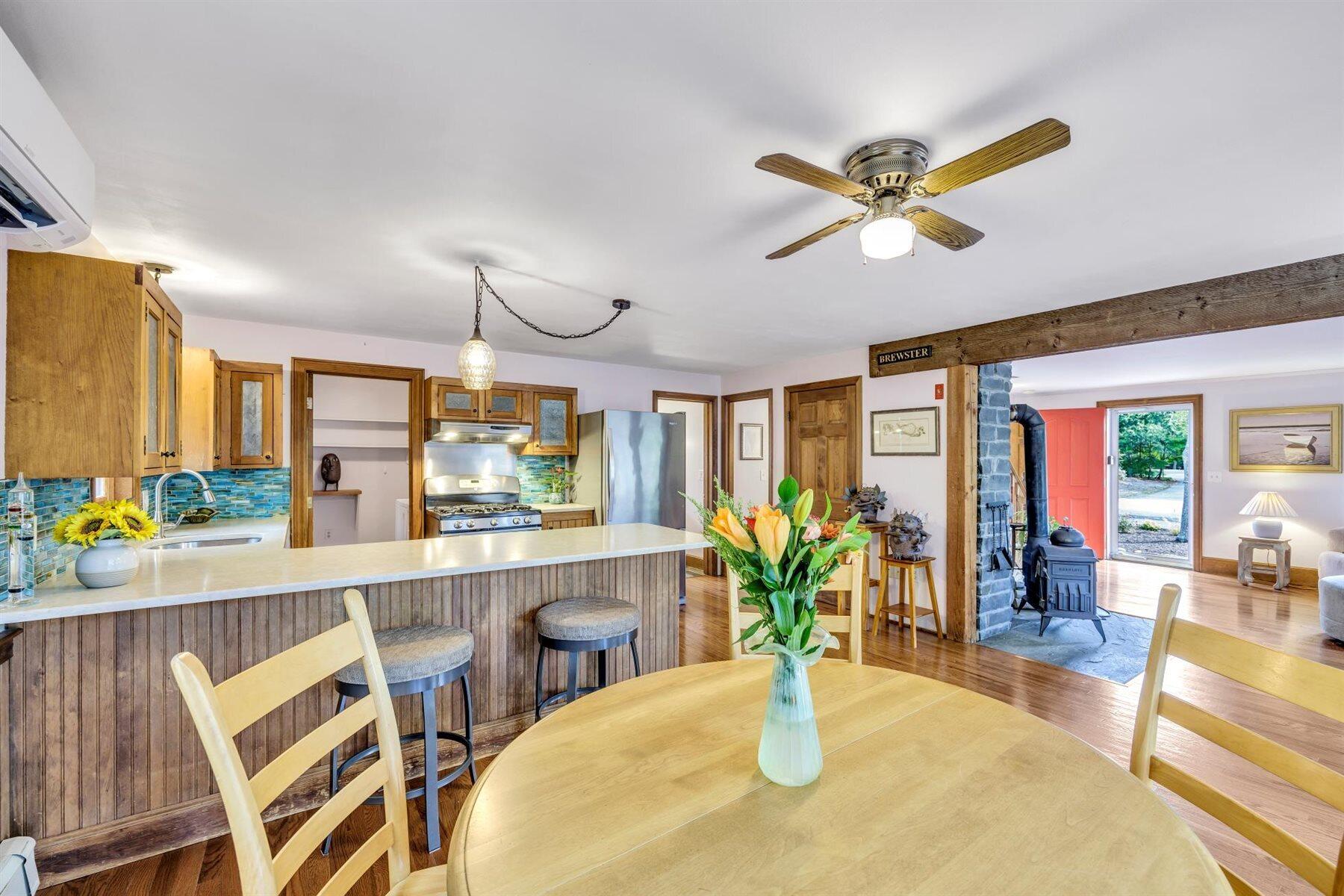 159 Old Chatham Road Brewster, MA 02631 - Photo 8 of 32 a dining room with furniture garden view and a chandelier