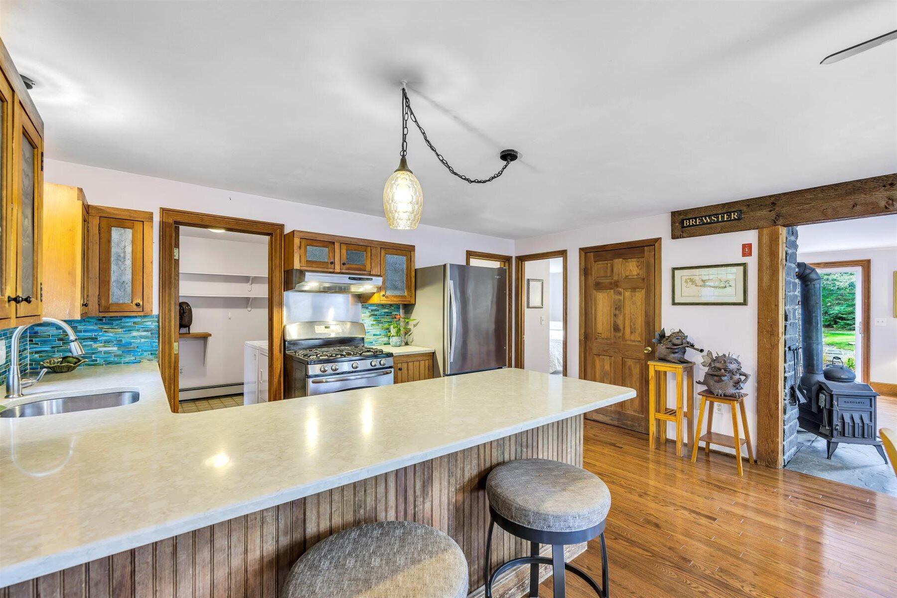 159 Old Chatham Road Brewster, MA 02631 - Photo 9 of 32 a view of a dining room with furniture window and wooden floor