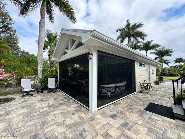 a view of a house with sitting area and furniture