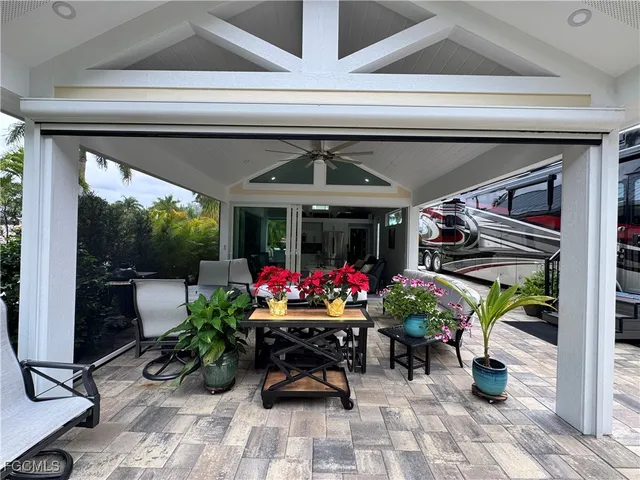 a view of a chairs and table in a patio