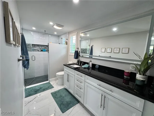 a spacious bathroom with a double vanity sink and a mirror