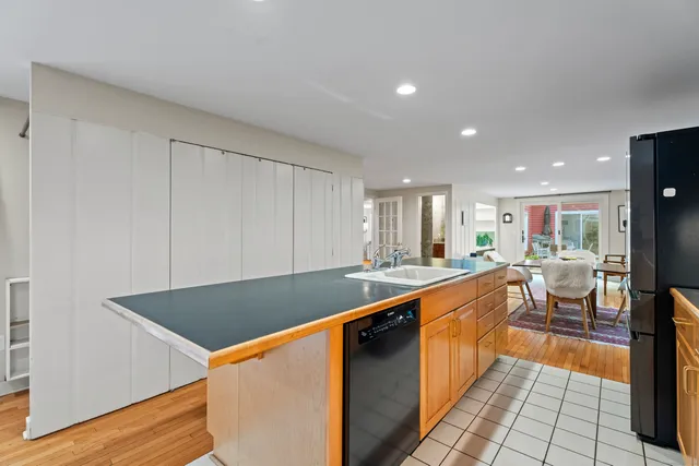 a large kitchen with lots of counter space and stainless steel appliances