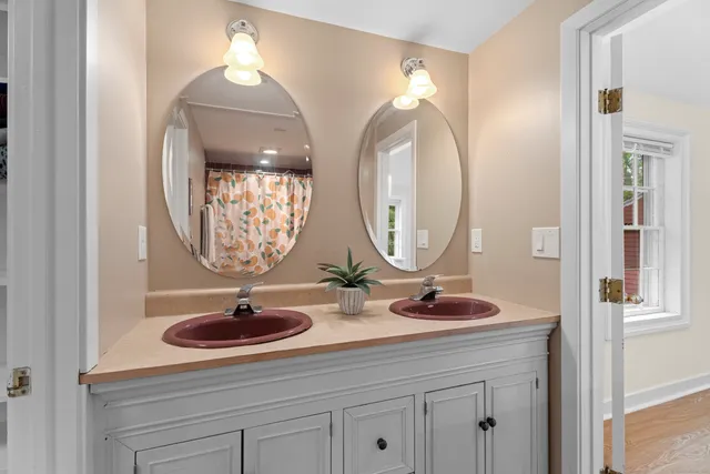 a bathroom with a sink and a mirror