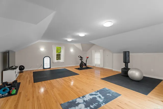 a view of a kitchen with dining table and chairs