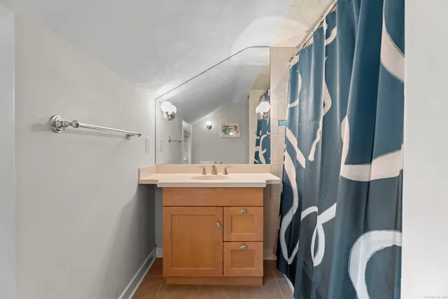 a bathroom with a sink and mirror