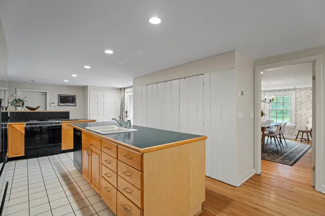 a kitchen with stainless steel appliances granite countertop a stove and a sink