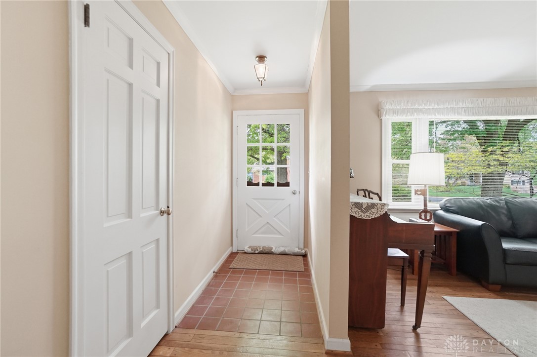 6119 Flemington Road Dayton, OH 45459 - Photo 75 of 76 This inviting entryway features warm flooring and natural light, creating a welcoming atmosphere.