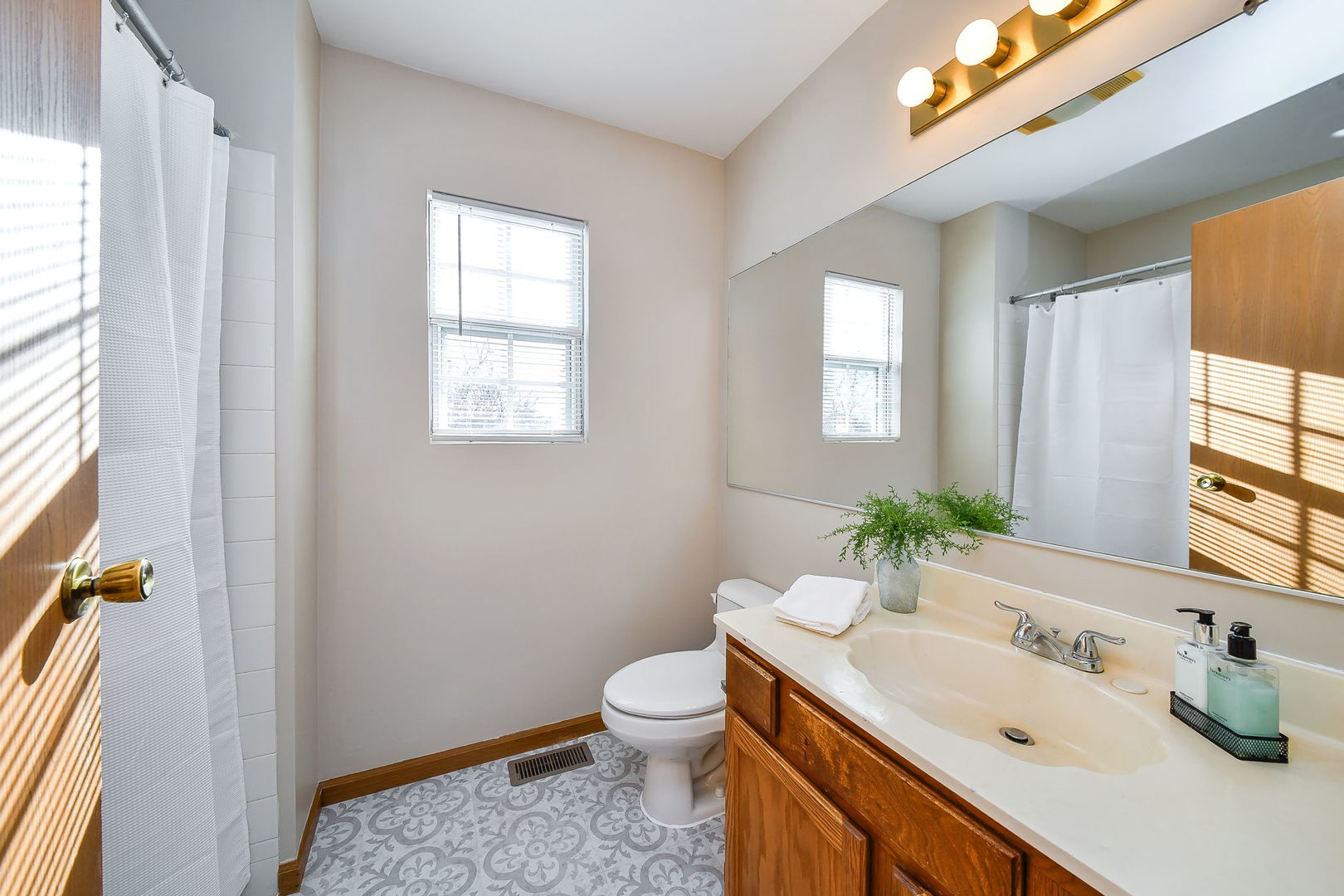119 Canton Lane Streamwood, IL 60107 - Photo 17 of 28 a bathroom with a granite countertop sink toilet and mirror
